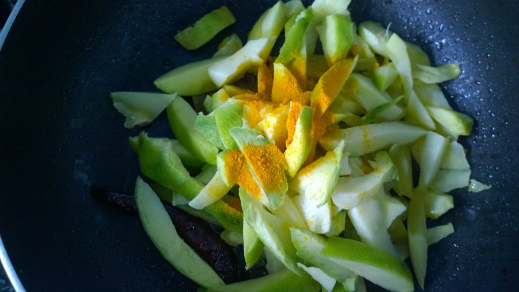 Raw mango with turmeric powder