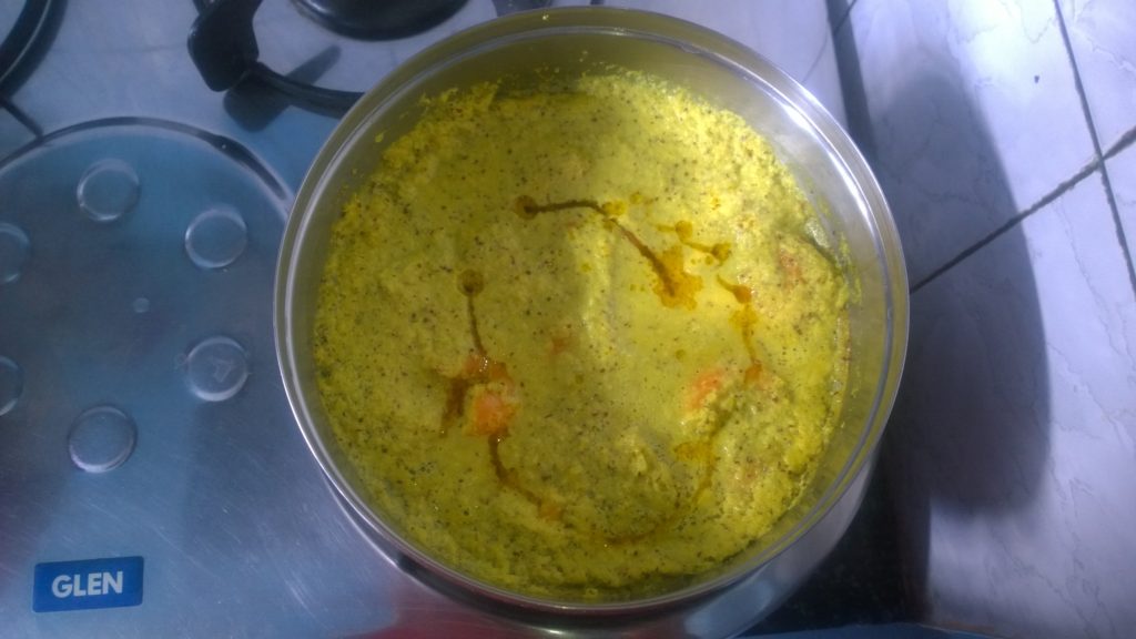 Steamed prawn curry cooked in a steel vessel.