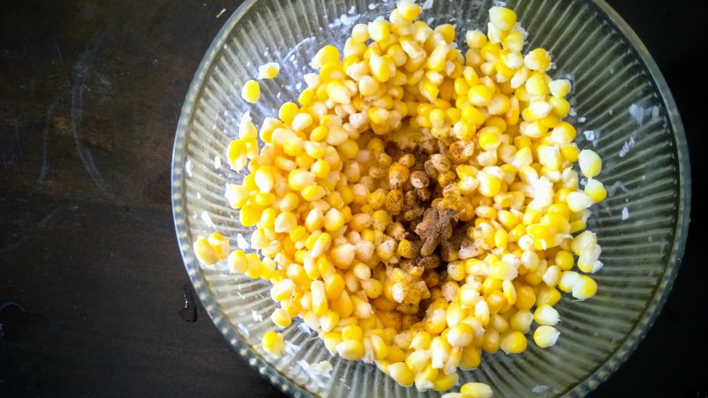 Salt and pepper added to make butter cheese cup corn
