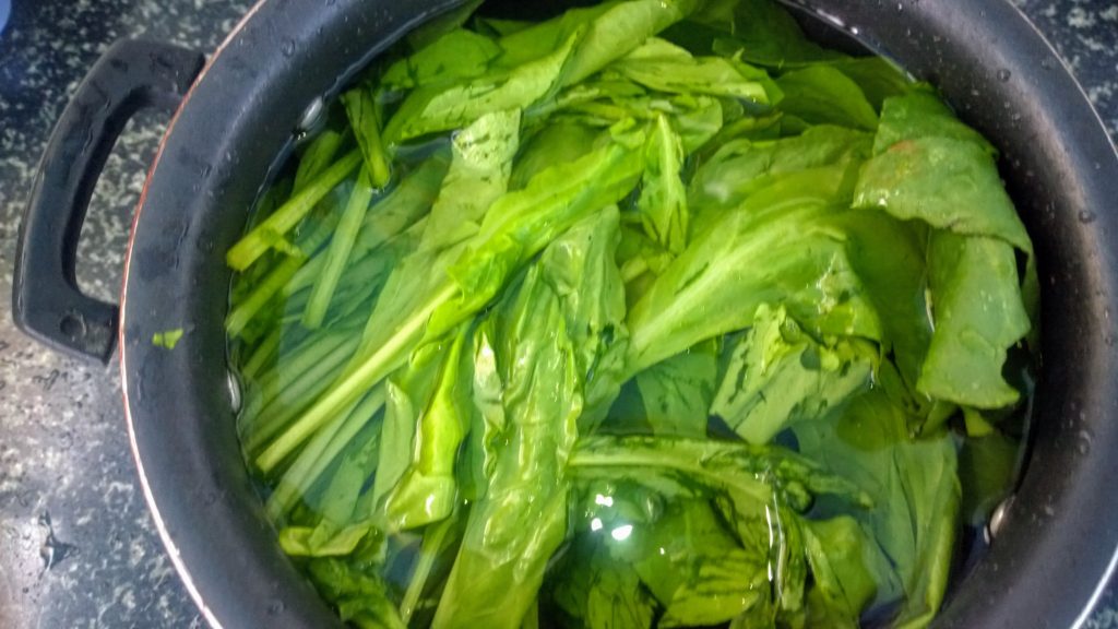 Spinach leaves soaked in water