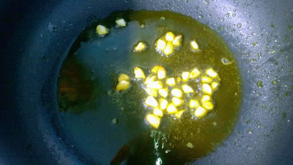 Garlic sauteing in hot oil. 