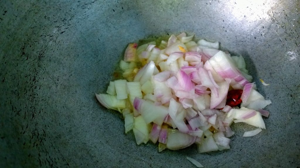 Onion, garlic and red chilli in hot oil.
