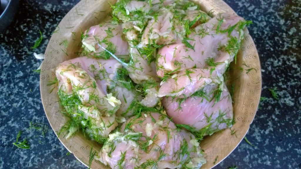 Chicken breasts massaged with olive oil, dill leaves and crushed garlic