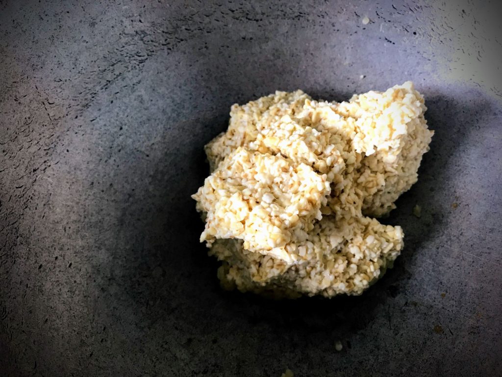 Soaked broken wheat in pan
