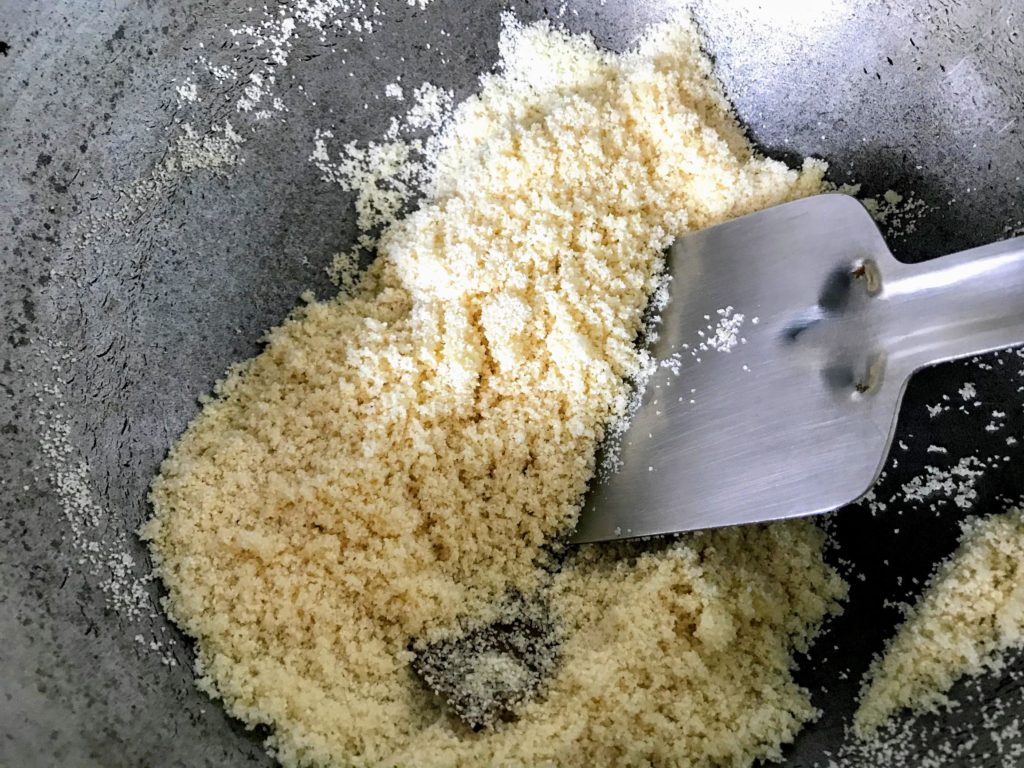 Mixing semolina with ghee