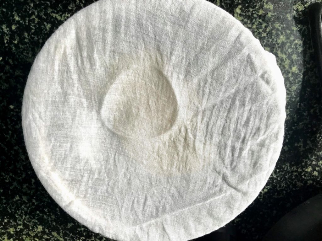 Dough covered with muslin cloth