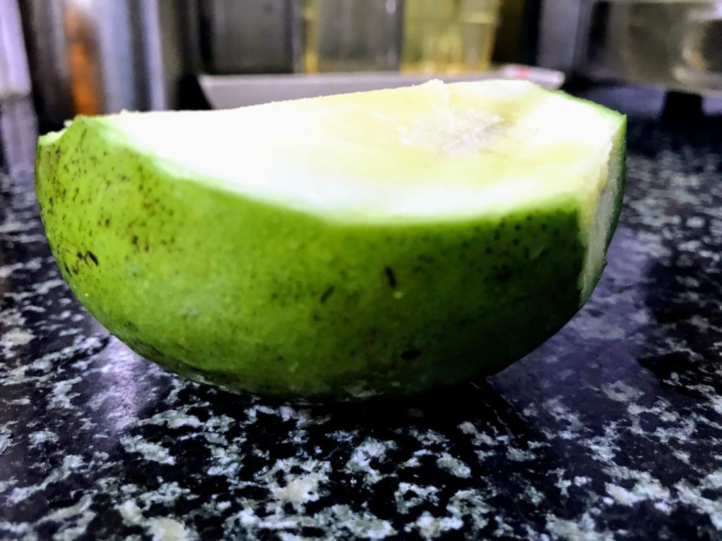Raw mango cut into half