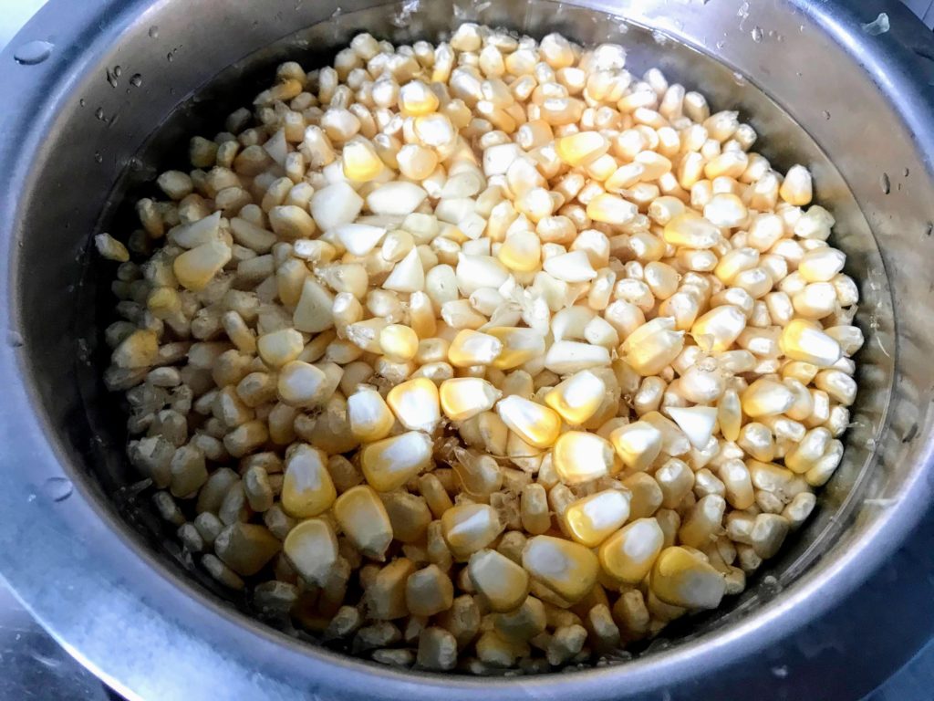 Corn kernels, garlic and water