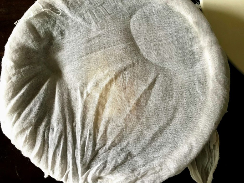 Dough covered with muslin cloth