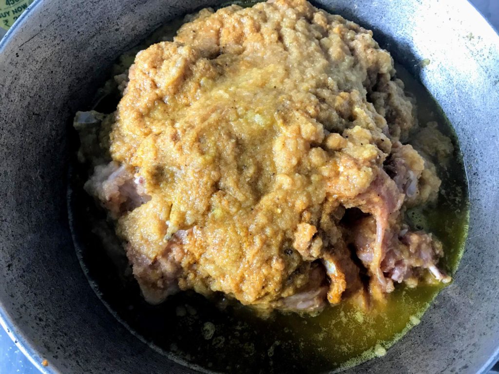 Cooking marinated chicken.