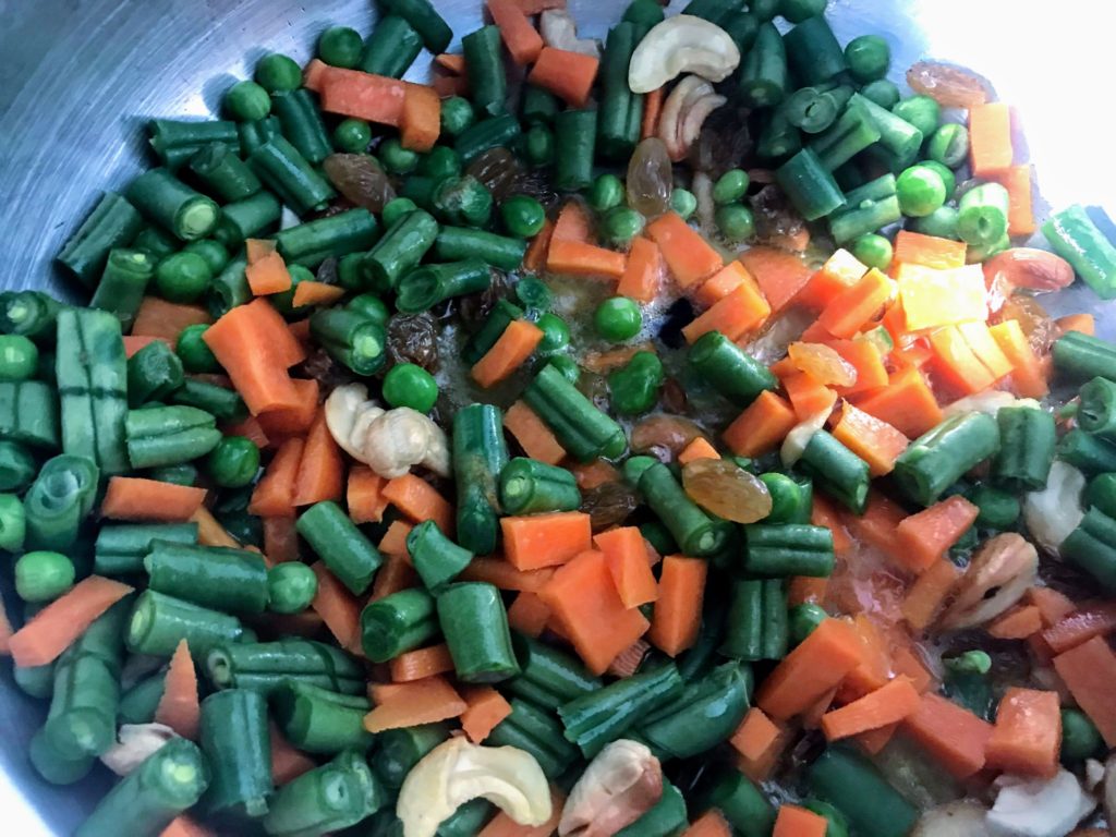Frying vegetables for Pulao