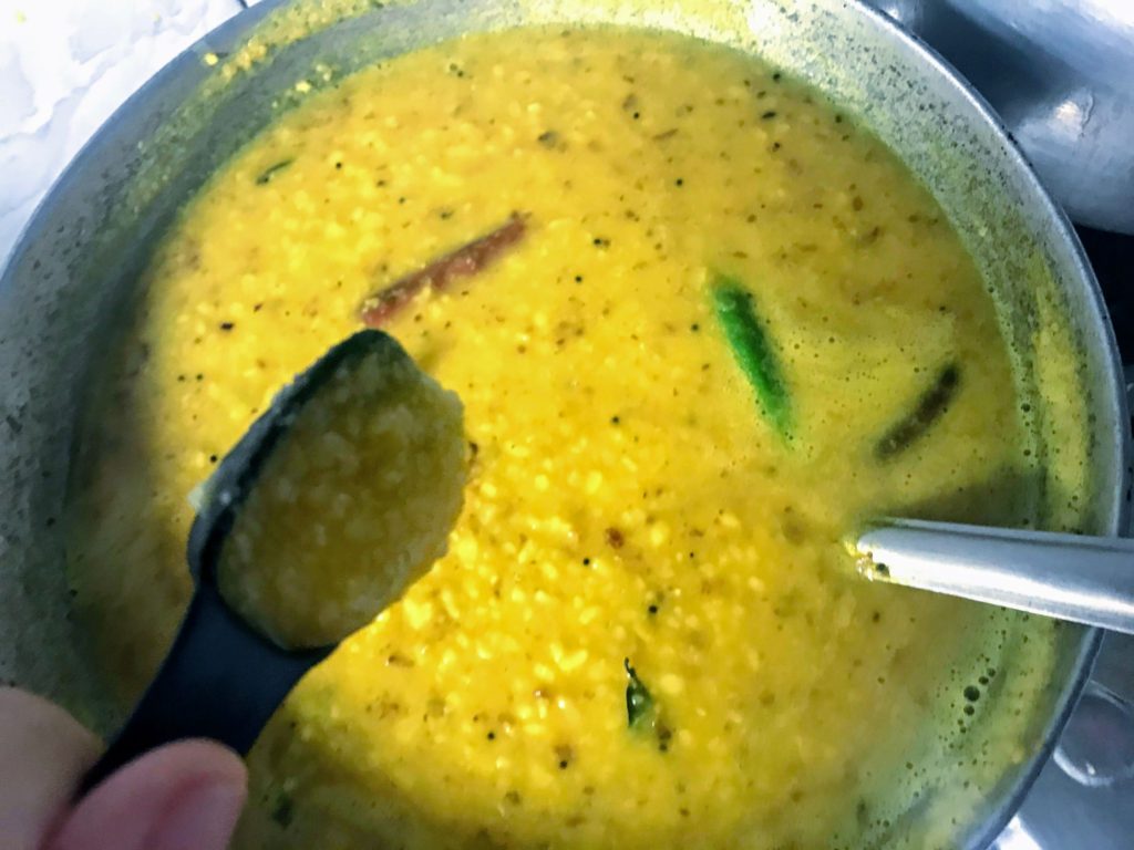 Adding ghee to a dal