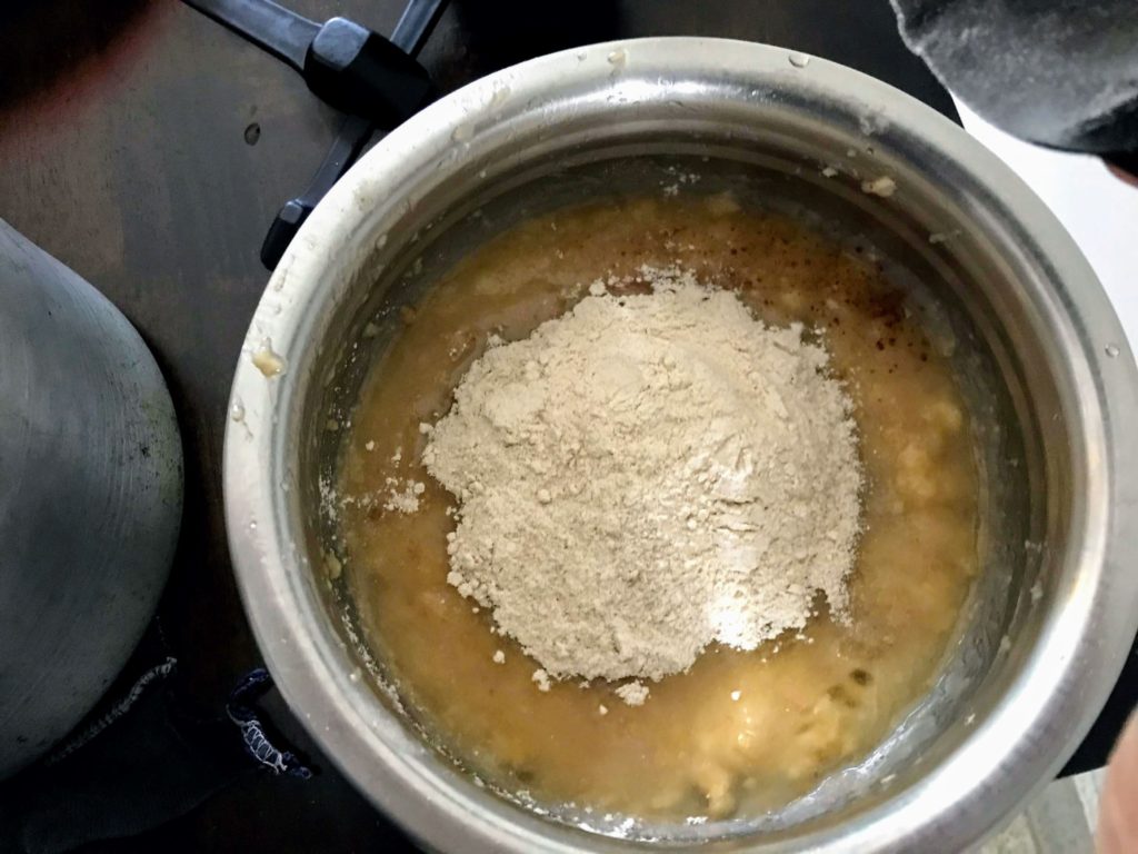 Adding flour to mashed banana