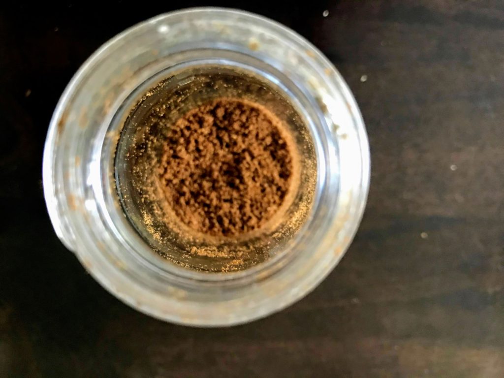 Cumin powder in a jar