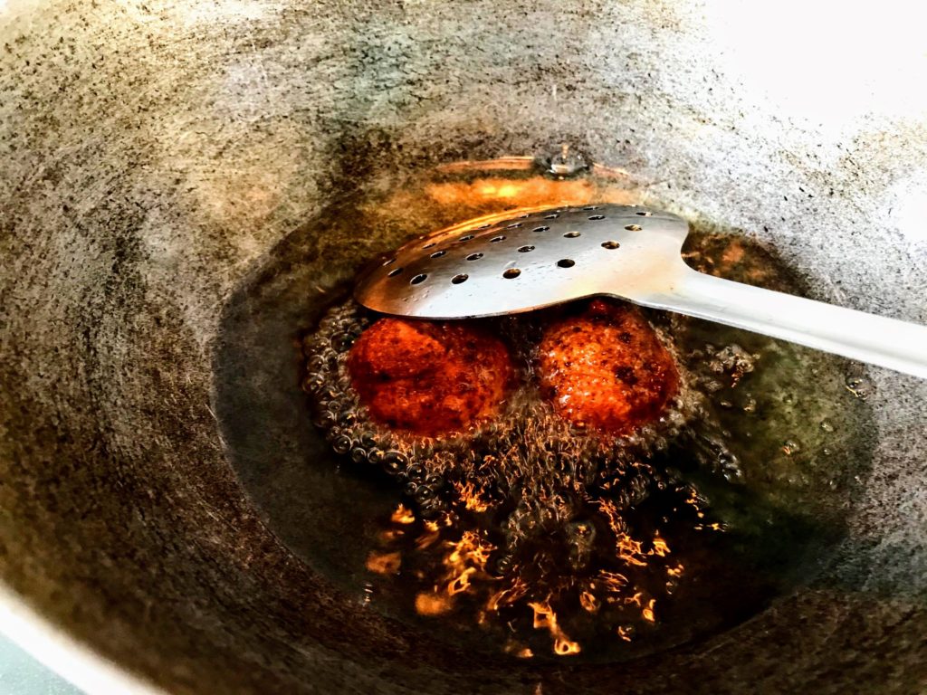 Frying gulab jamun