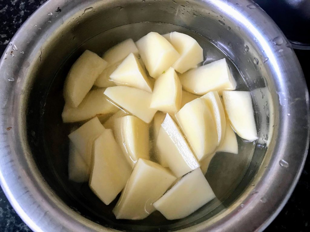 Potatoes cut to half wedges