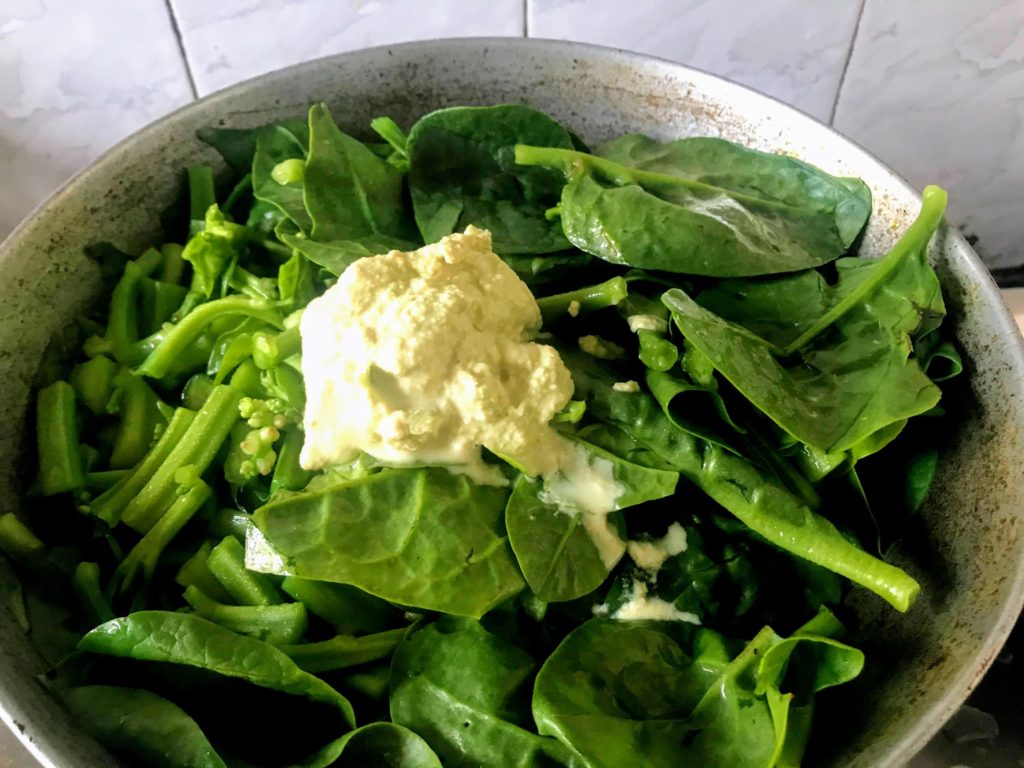 Adding mustard paste to cook vegetables