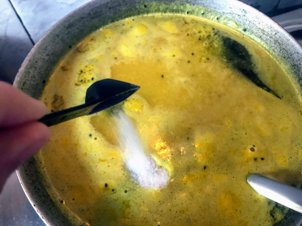 Adding salt to dal