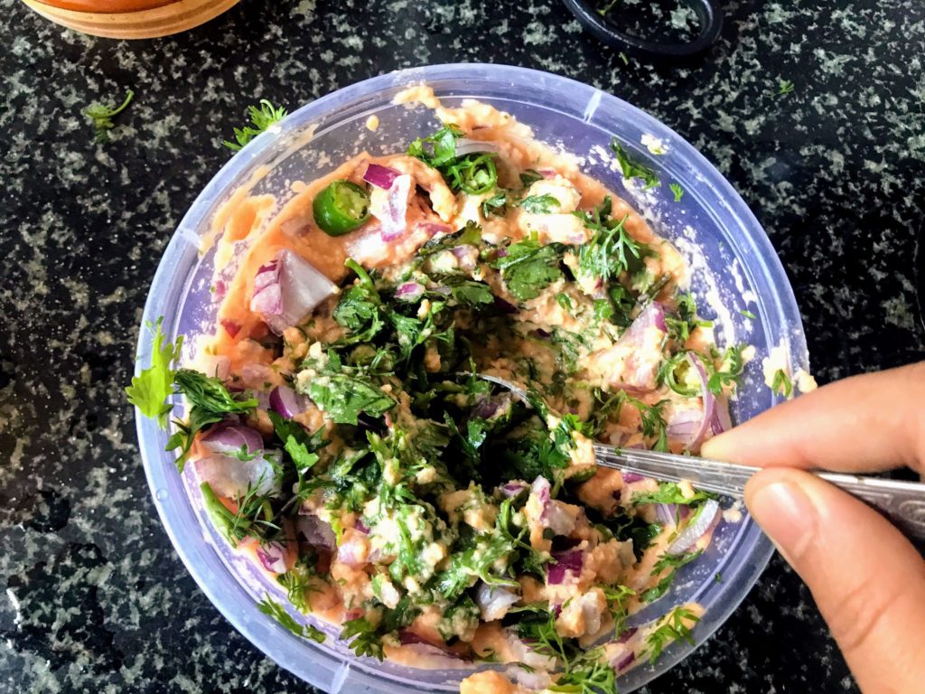 Preparing Mushur Daler Bora batter