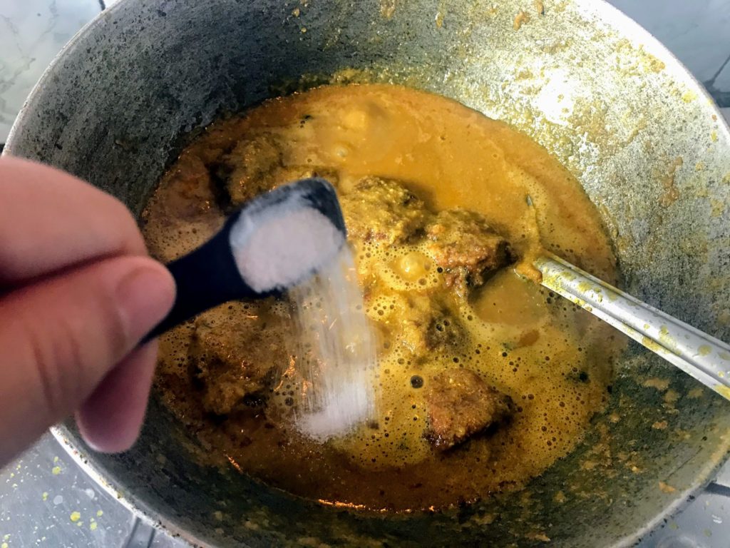 Adding salt to curry