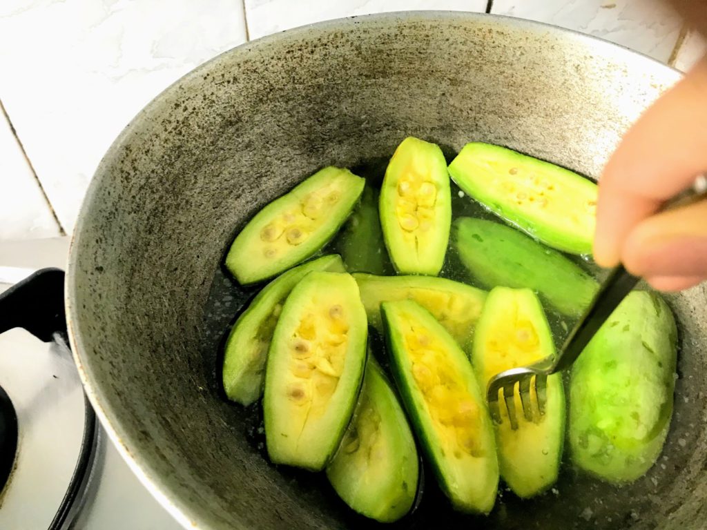 Checking tenderness of gourd