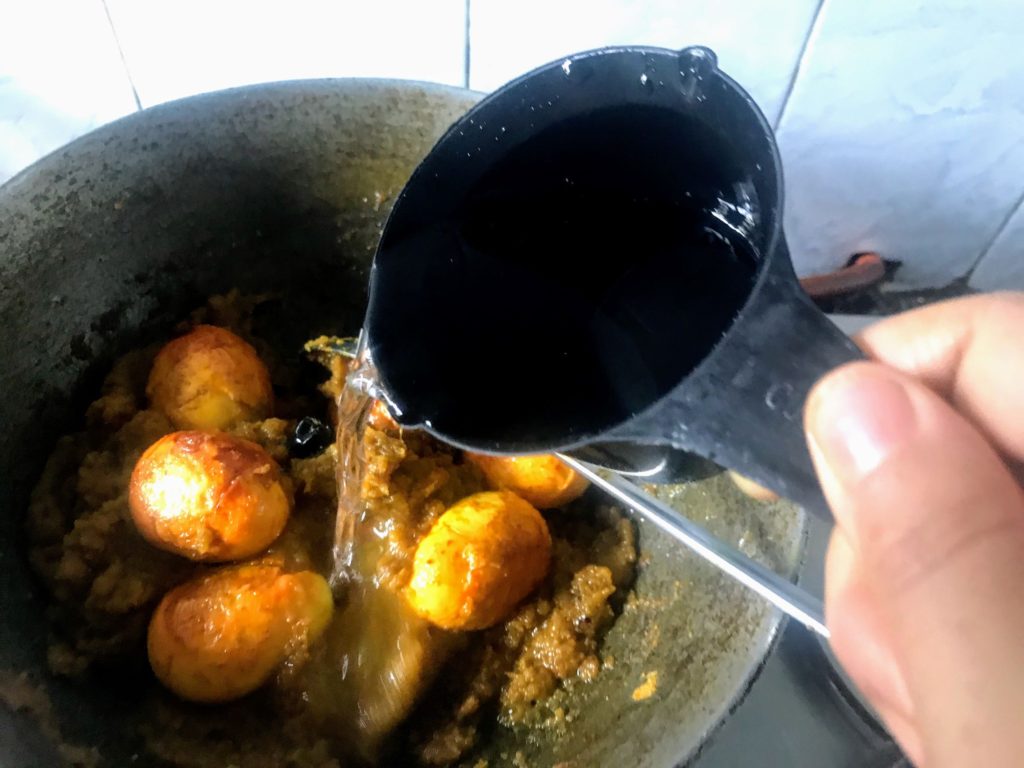 Adding water to make curry