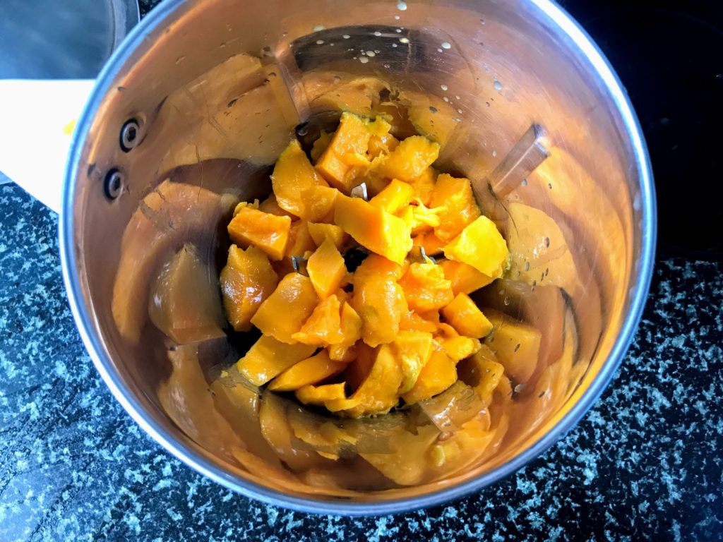 Mango pieces in a blender