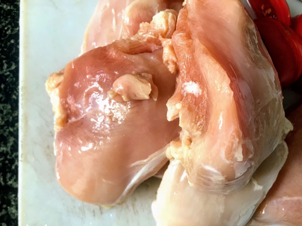 Raw chicken breast pieces