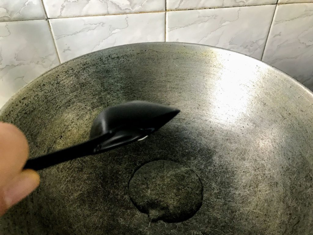 Heating oil in a wok