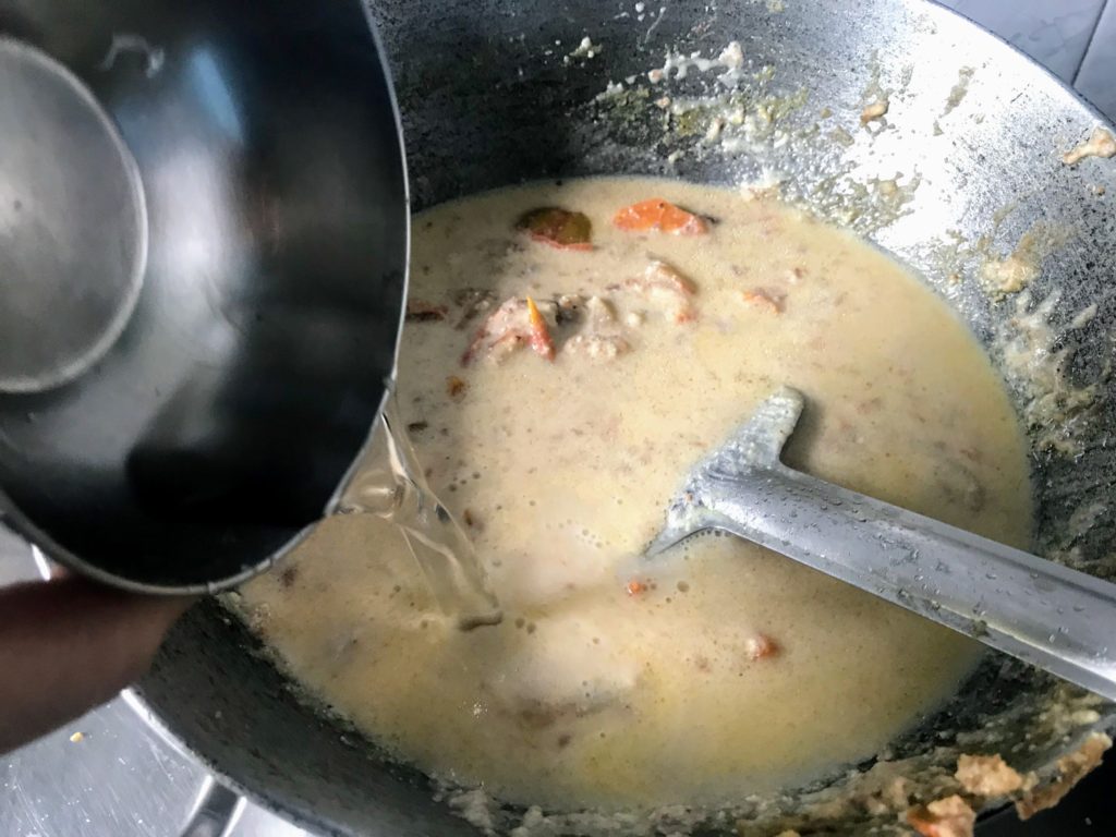 Adding water to make curry