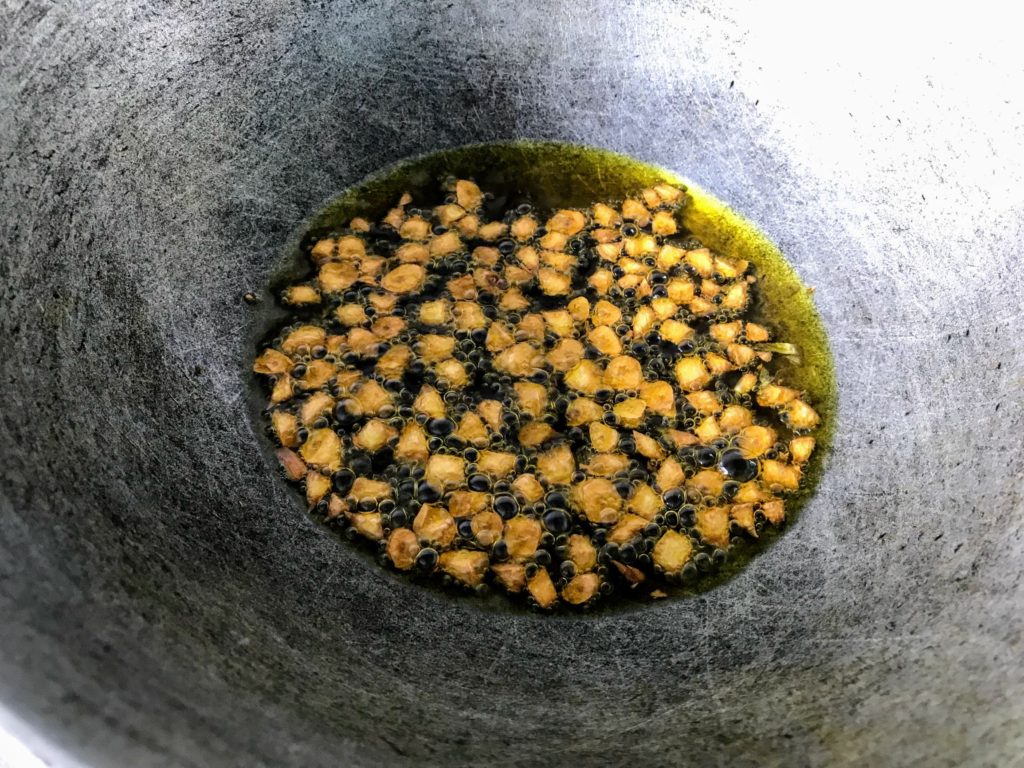 Frying chopped garlic