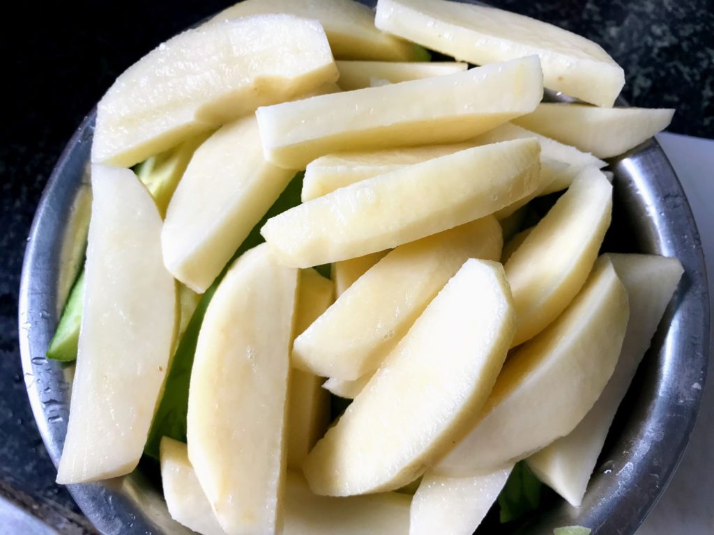 Potatoes cut to wedges