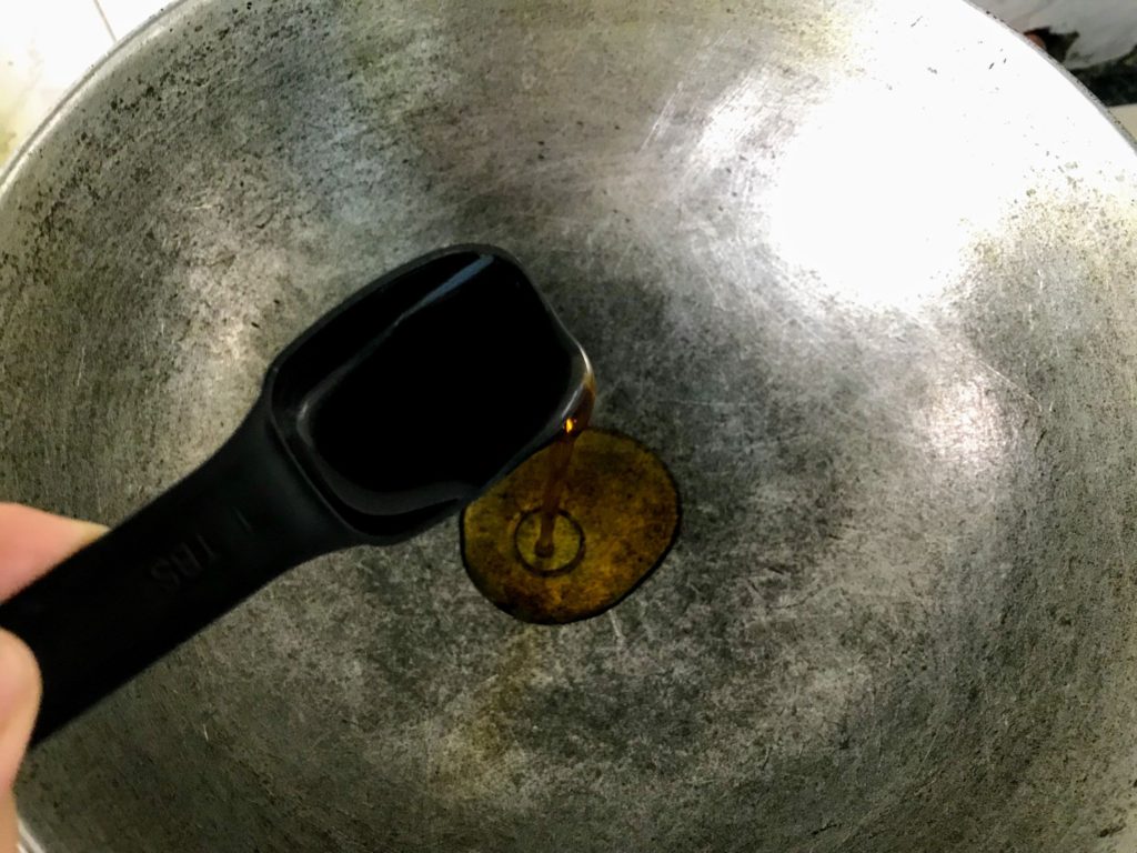 Heating oil in a wok