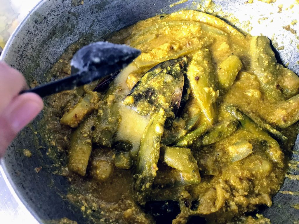 Adding ghee to Doi Potol