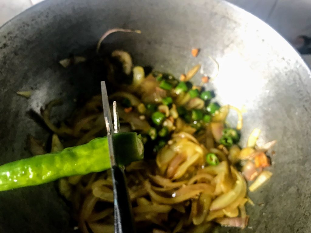 Chopping green chillies