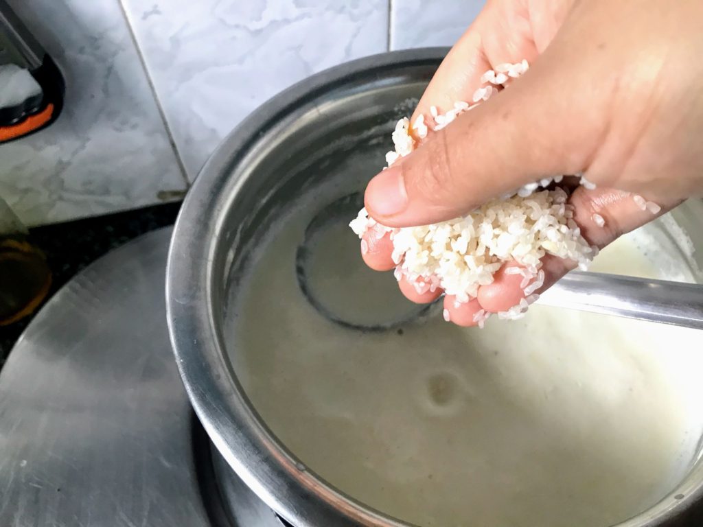 Adding rice to make kheer