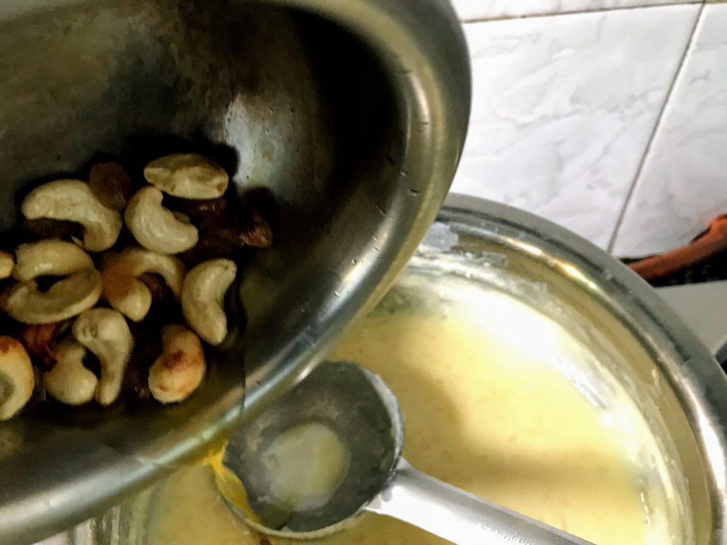 Adding dry fruits to kheer