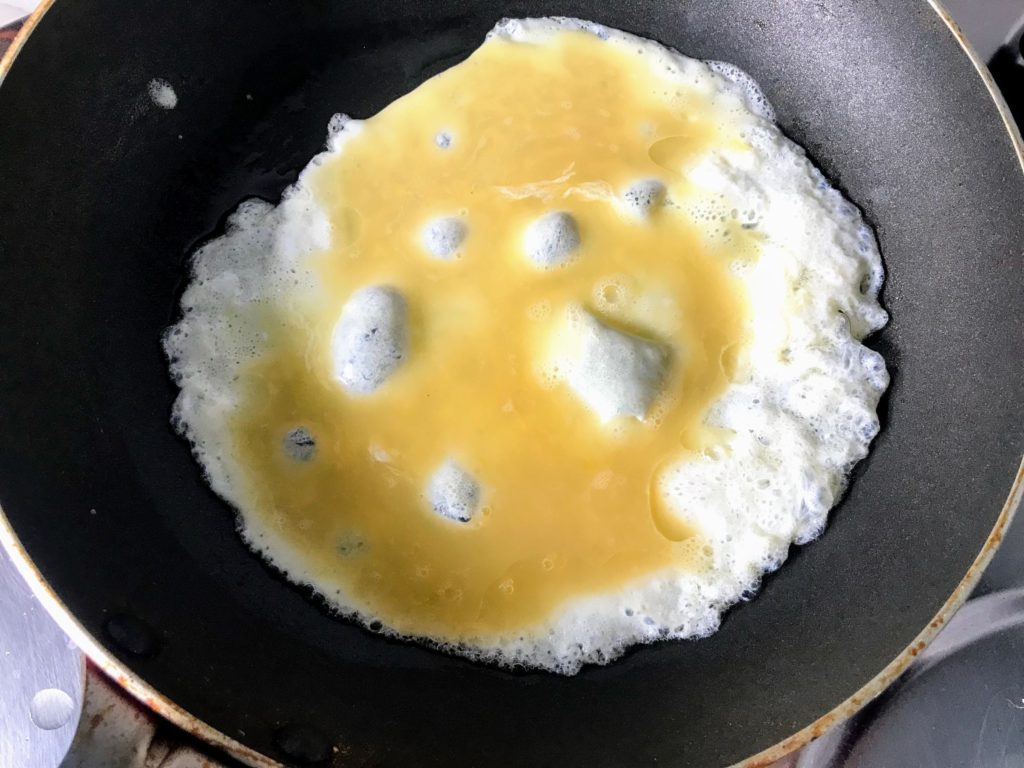 Whisked egg in the pan
