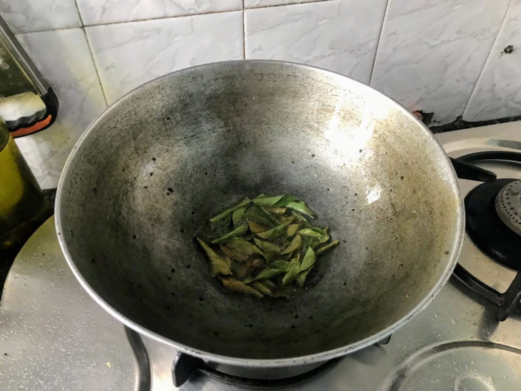 Tempering with curry leaves