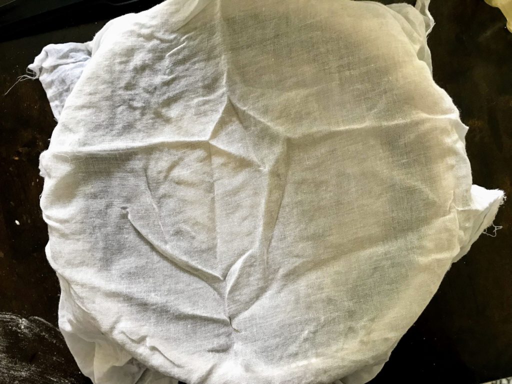 Dough covered with muslin cloth