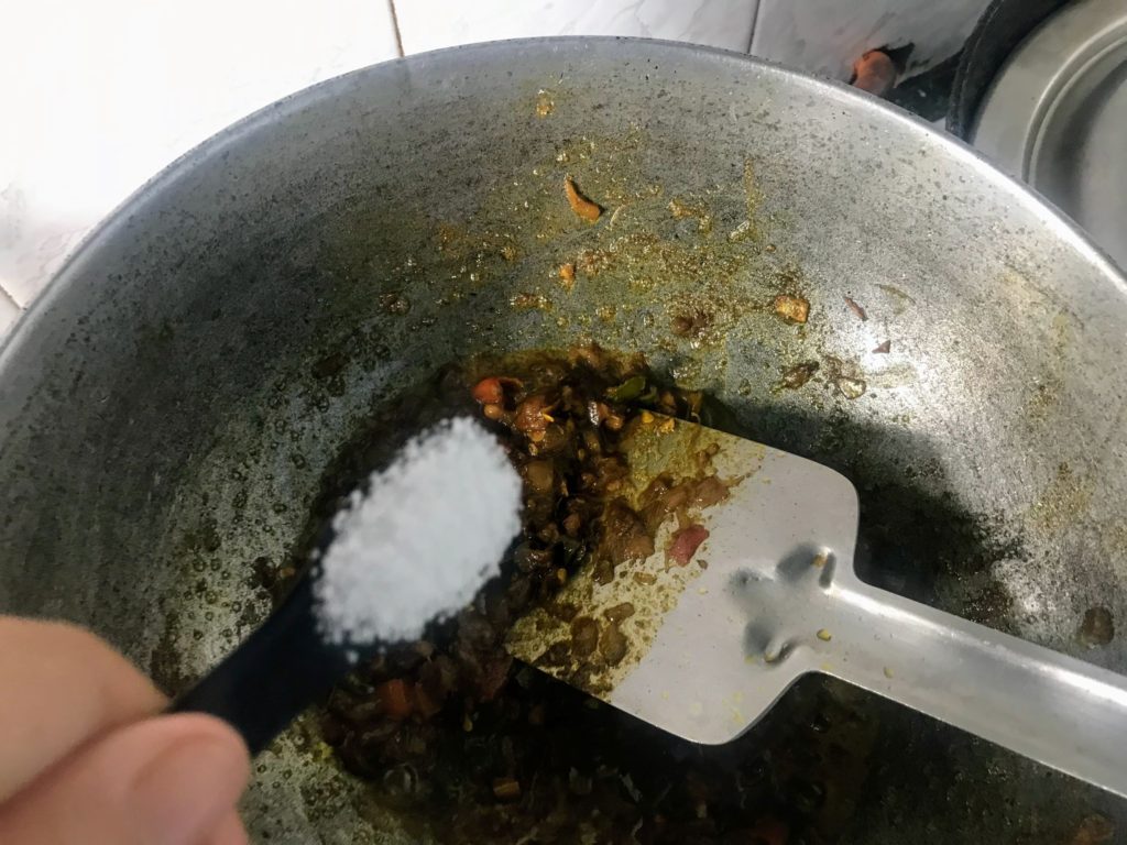 Adding salt to Shidol Chutney