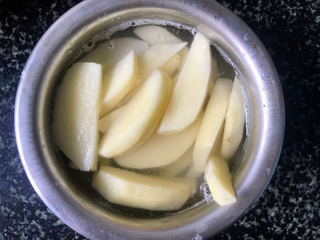 Potatoes cut to wedges
