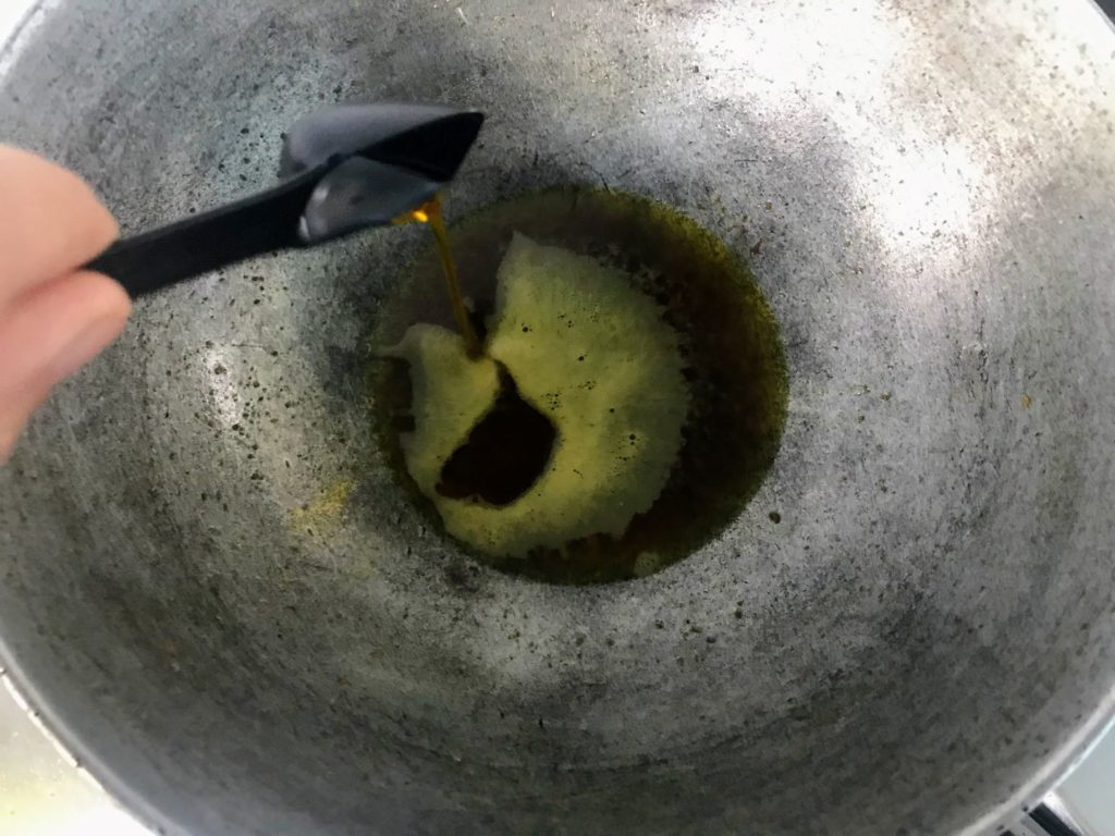 Adding oil in a wok
