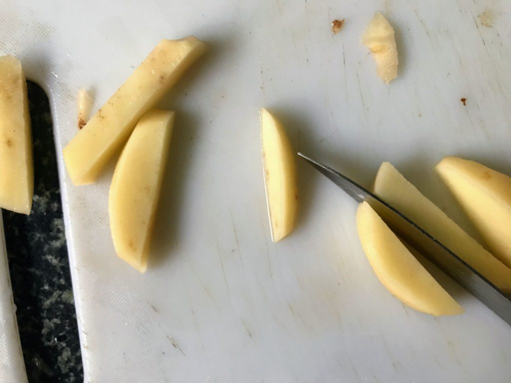 Cutting potato to wedges