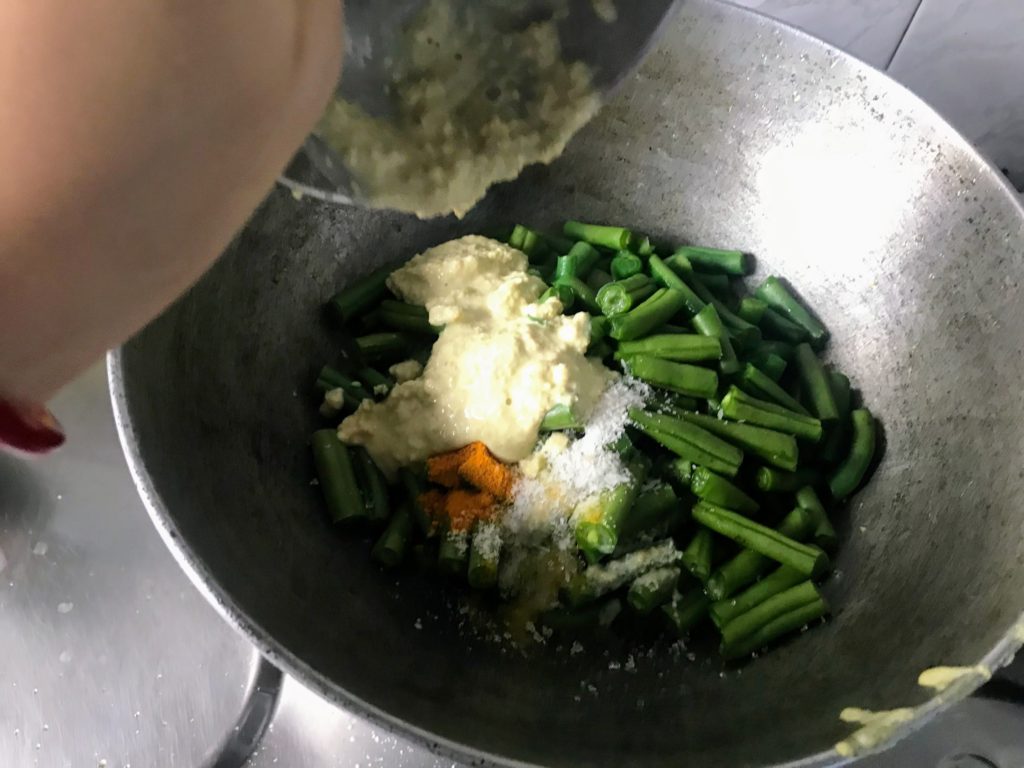 Adding mustard paste to vegetables