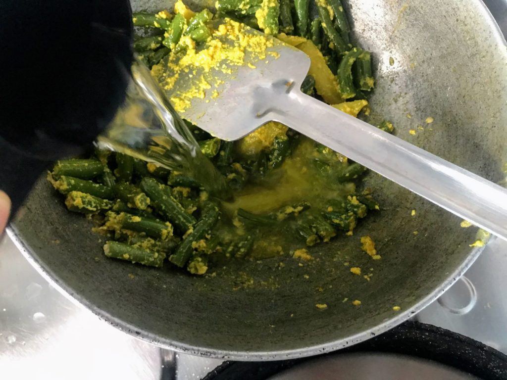 Adding water to cook vegetables