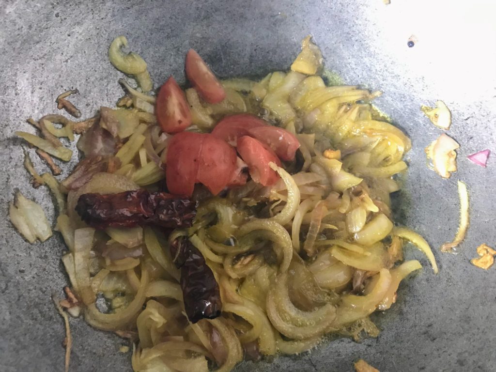 Tomato pieces on fried onion