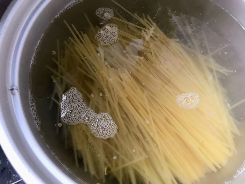Spaghetti in water for cooking