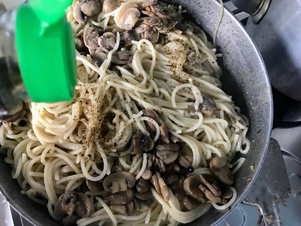 Adding seasoning to Pasta