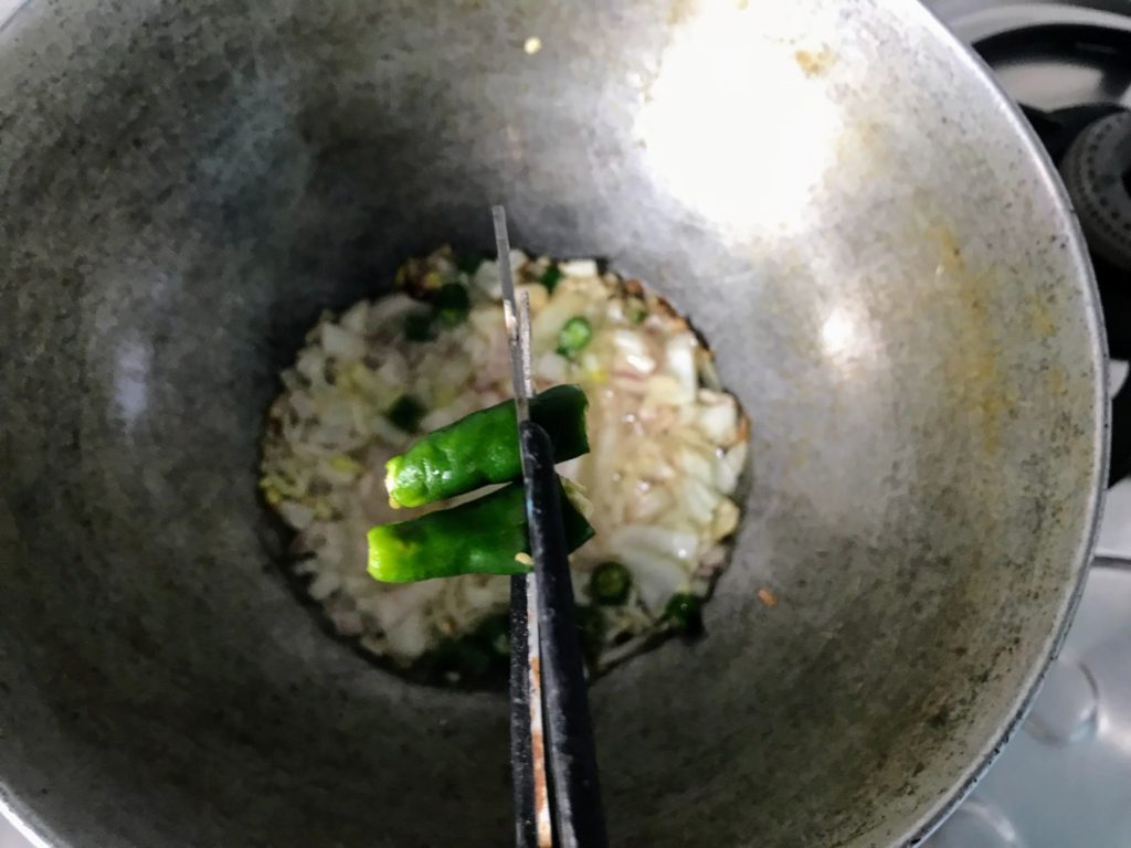 Chopping green chillies